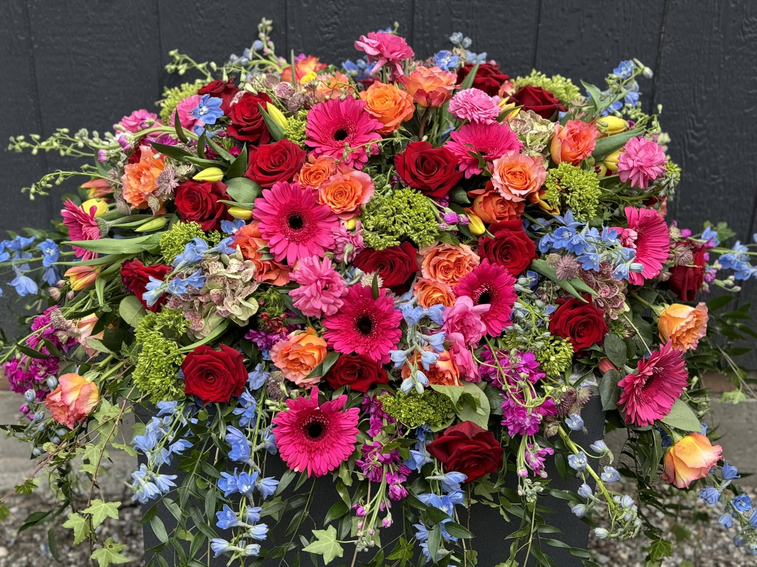 Elegant and Vibrant Funeral Casket Spray